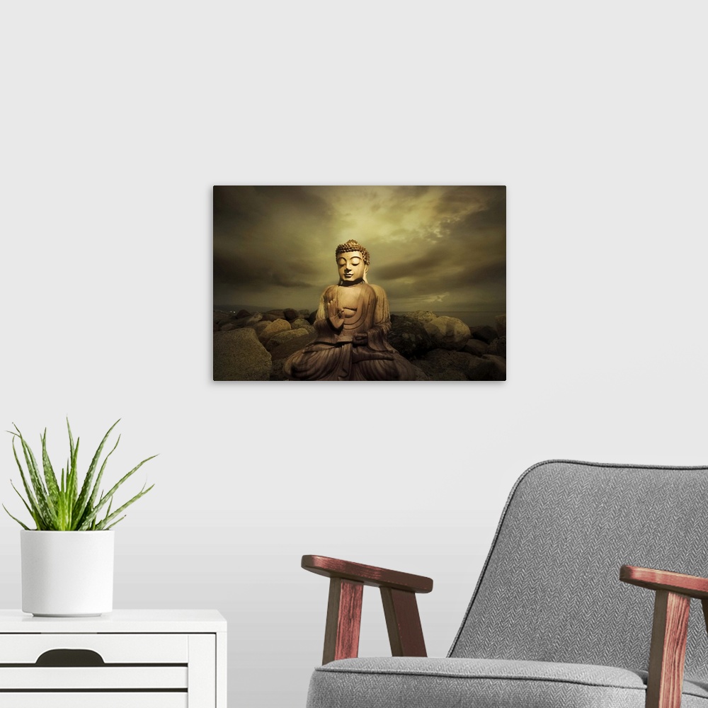 A modern room featuring A bhudda on a rocky shore