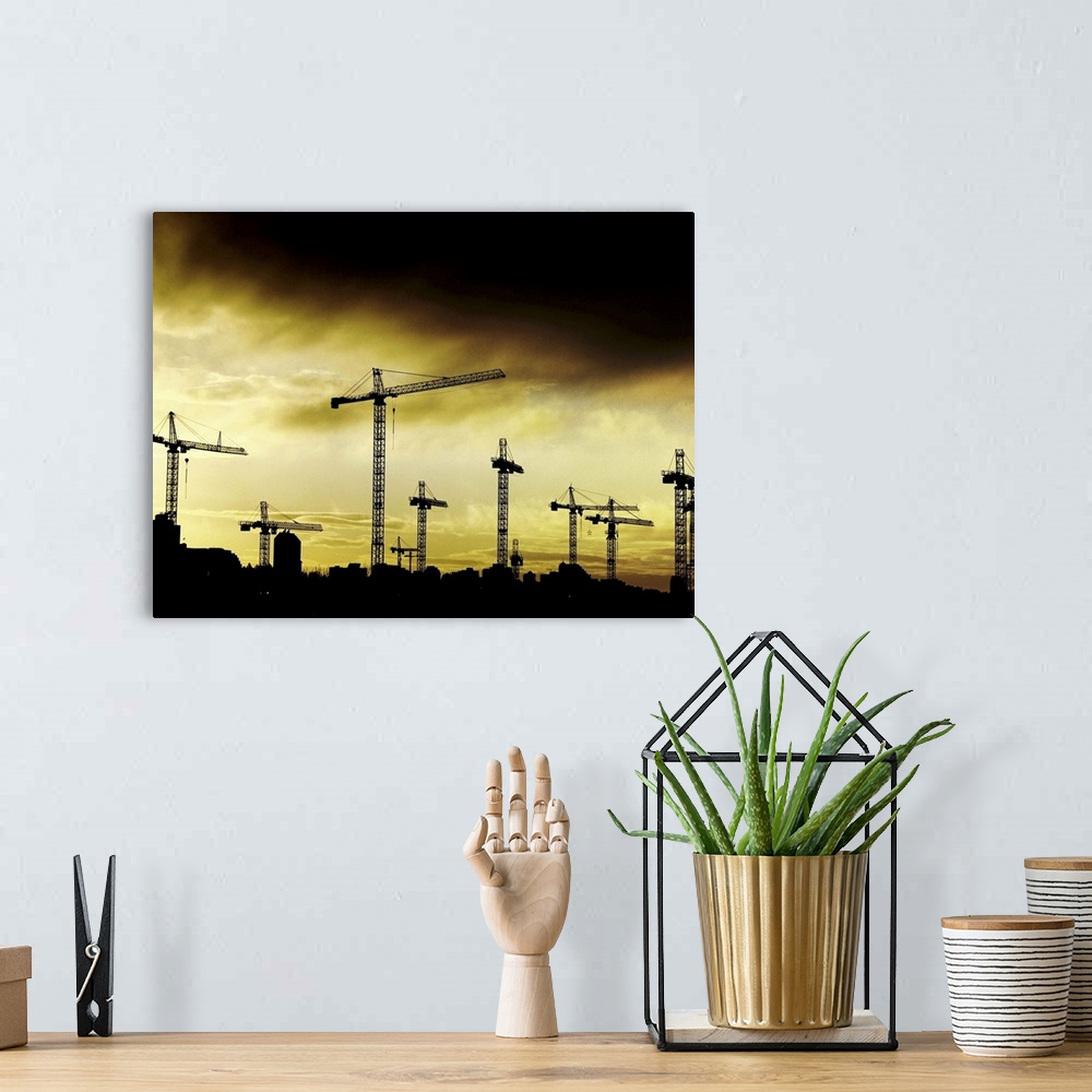 A bohemian room featuring Building cranes set against a stormy yellow sky