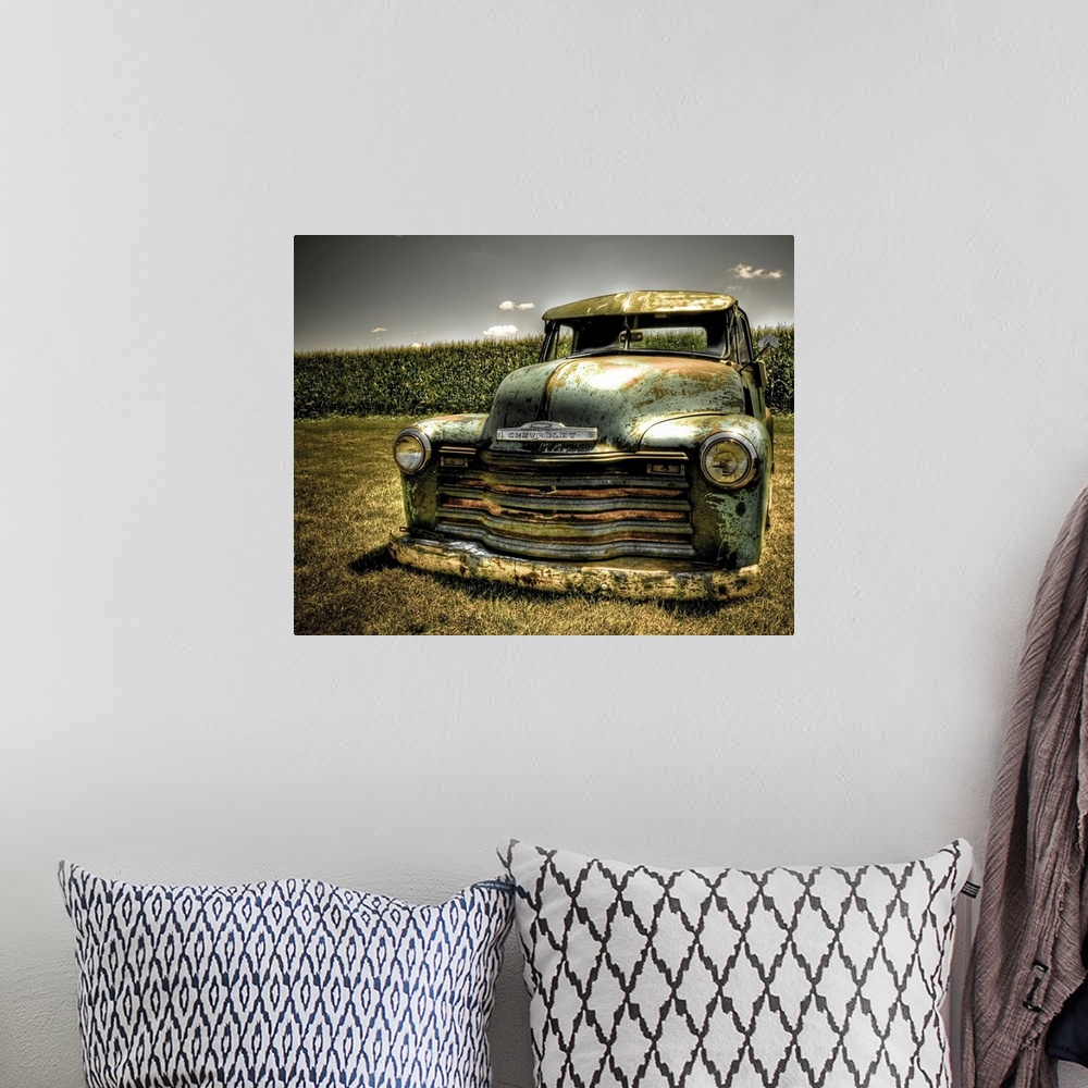 A bohemian room featuring A photo on canvas of a vintage Chevrolet truck parked in front of a corn field.
