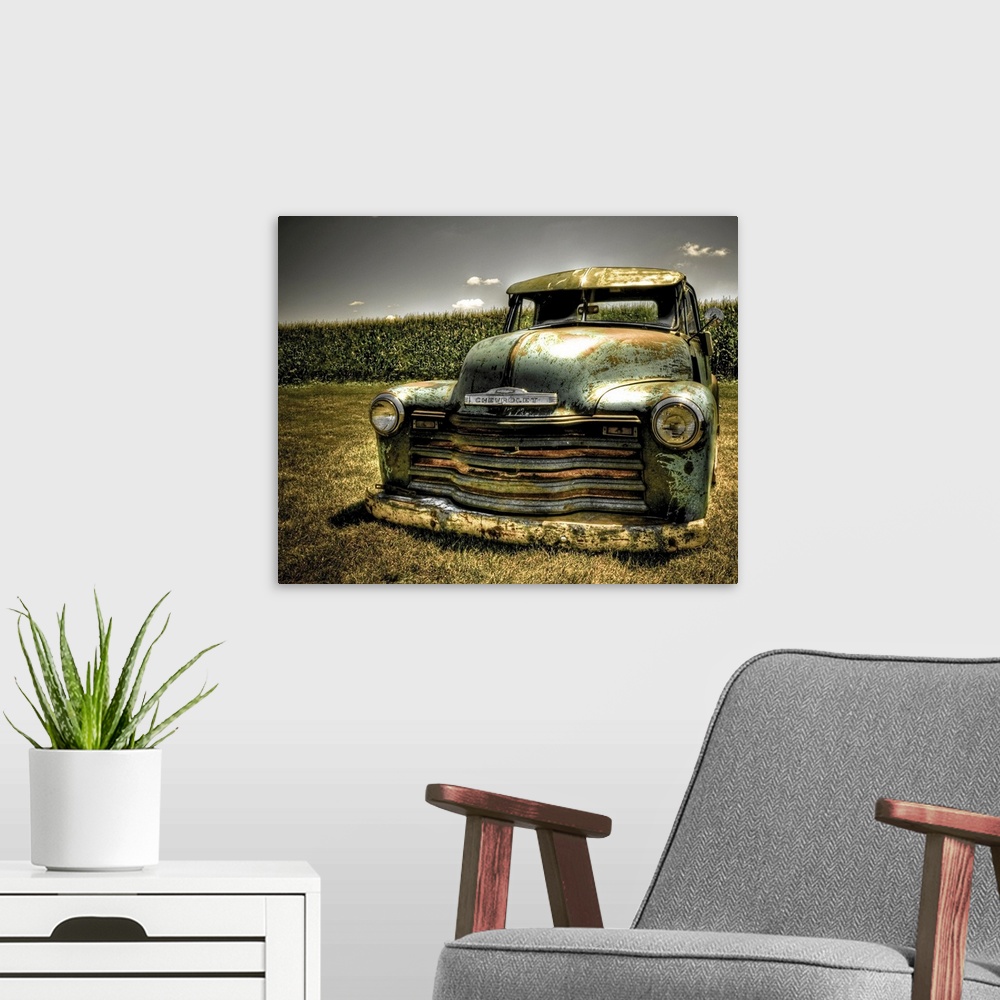 A modern room featuring A photo on canvas of a vintage Chevrolet truck parked in front of a corn field.