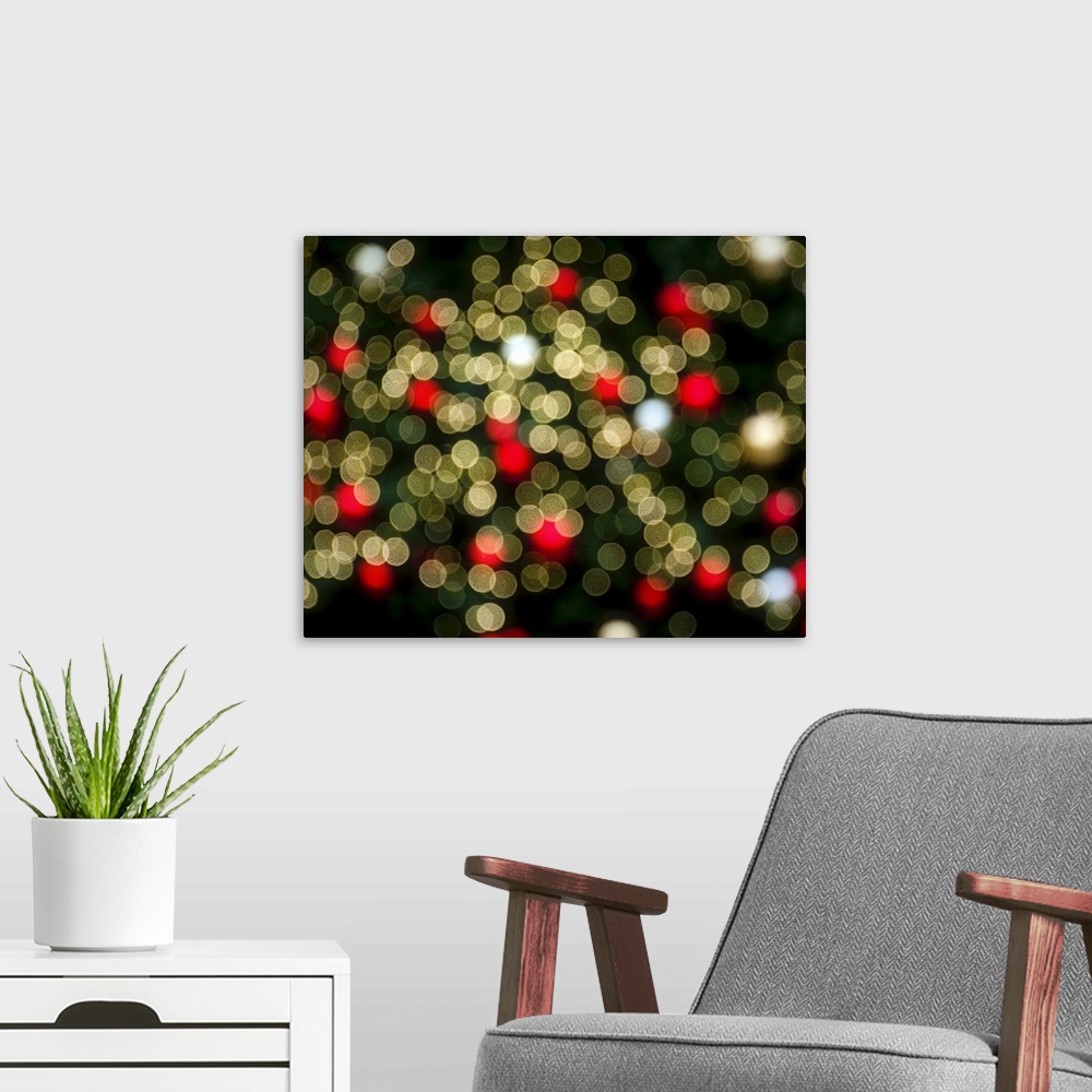 A modern room featuring A blur of bokeh lights in red and white in the city at Christmastime.