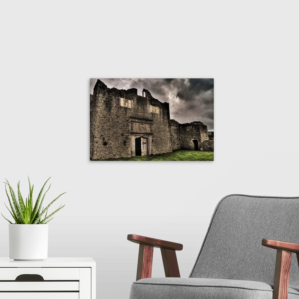 A modern room featuring Beaupre Castle medieval ruins in Wales.