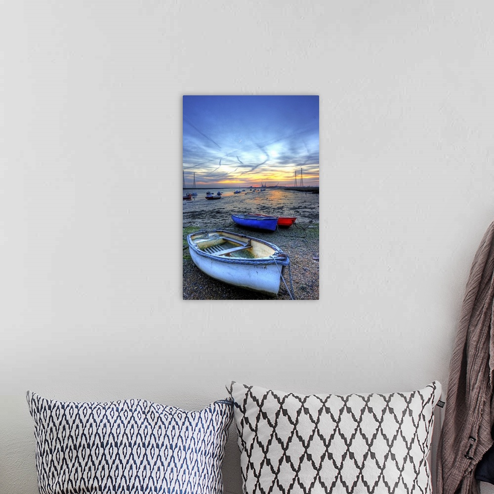 A bohemian room featuring Early morning frosty mid winter sunrise over the river swale and low tide mud flats and boats and...