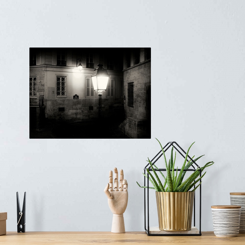 A bohemian room featuring Paris back street at night with street light
