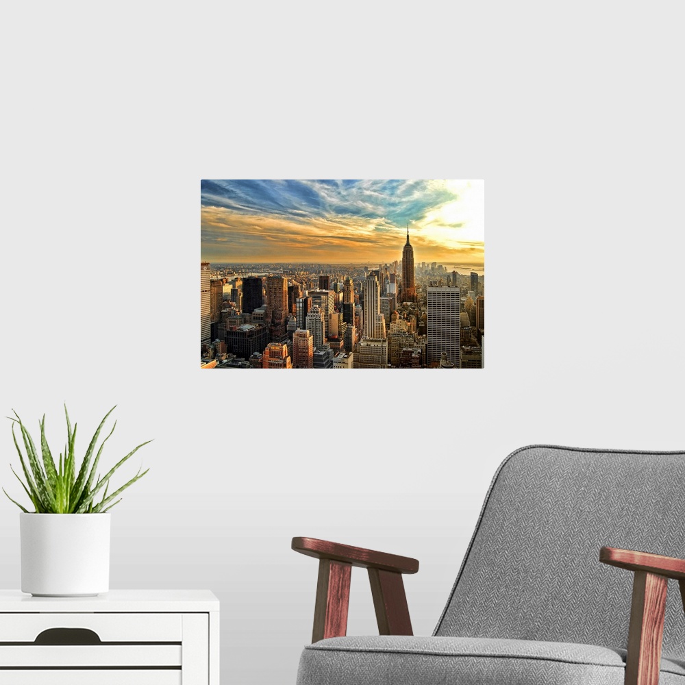 A modern room featuring HDR image overlooking southern half of Manhattan, New York City, with Empire State Building.
