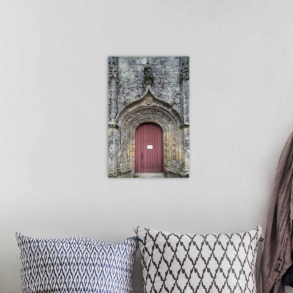 A bohemian room featuring Entrance door of the Trinity chapel, town of Plumergat, France