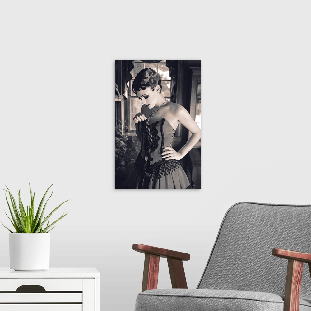 A modern room featuring A vintage photo of a saloon girl in a fancy dress in front of a window looking down and holding h...