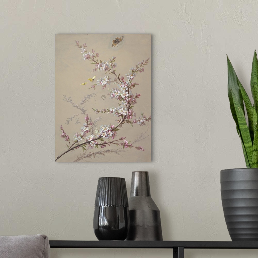 A modern room featuring Branch with white blossoms and foliage in a reverse "c" shape, with grasses behind it. Two yellow...