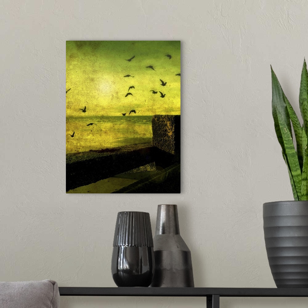 A modern room featuring A flock of birds flying over a beach scene with breakers