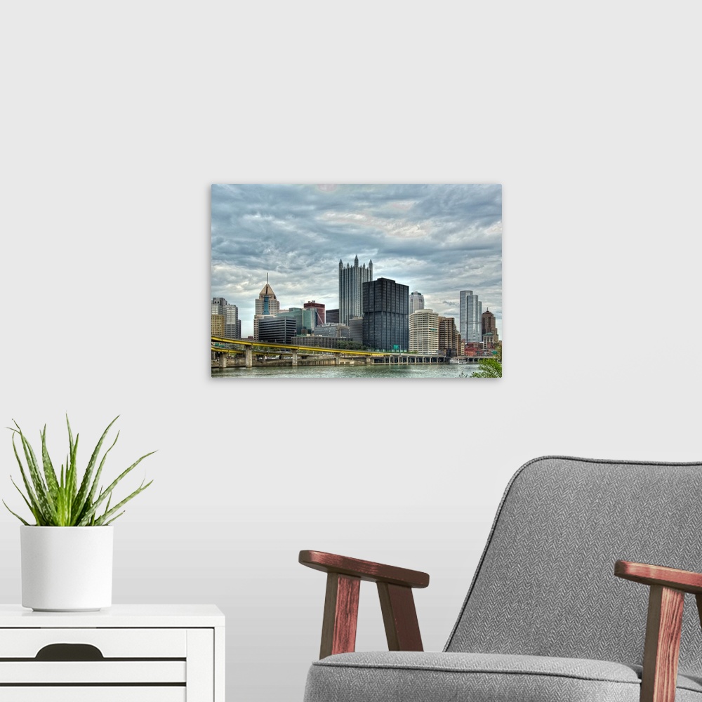 A modern room featuring High rise building across the river in Pittsburgh