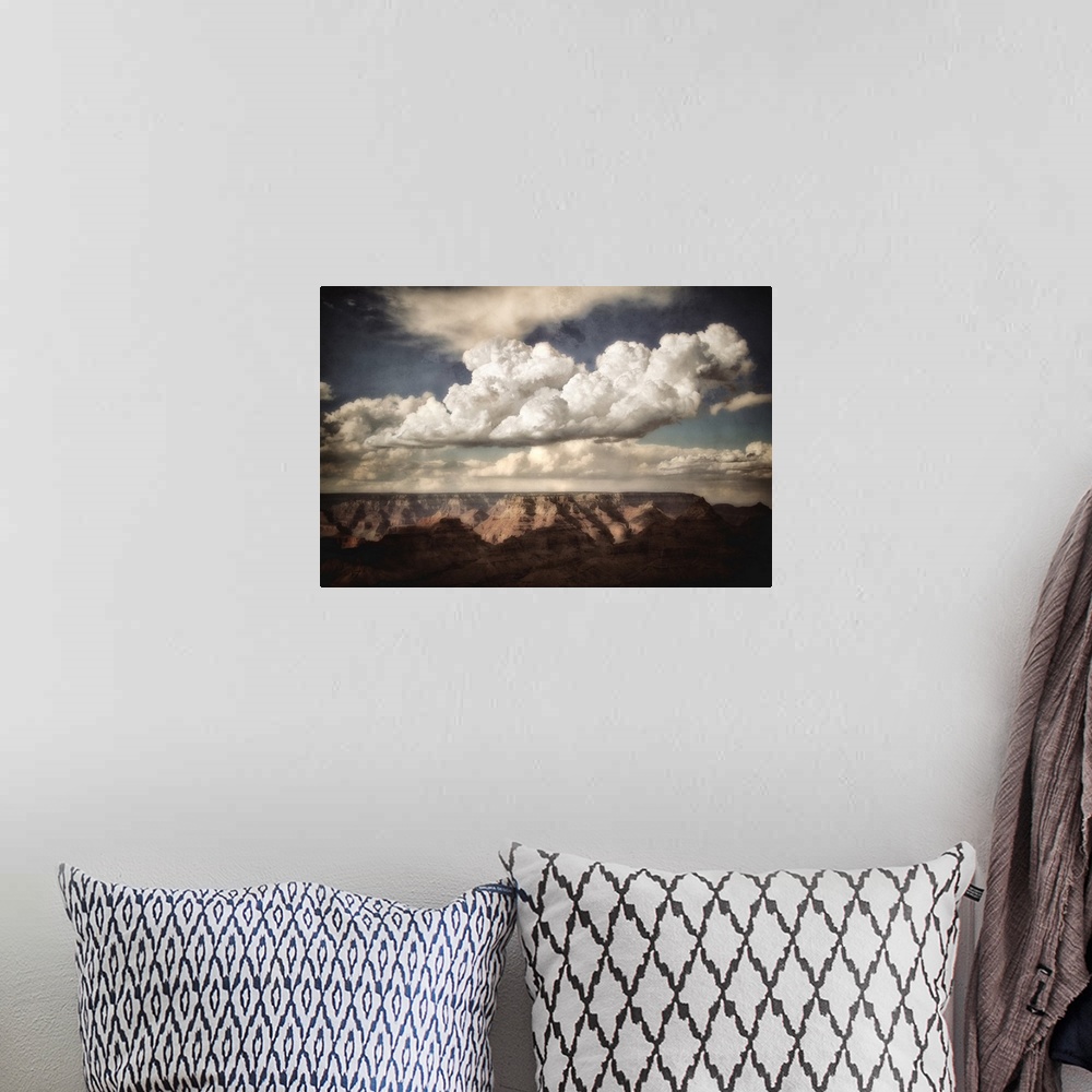 A bohemian room featuring Huge canyon in the background looking across the Grand Canyon in USA with clouds in a blue summer...