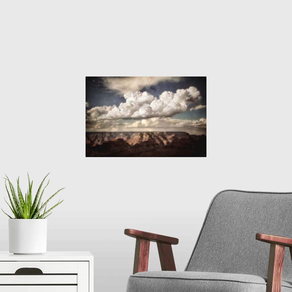 A modern room featuring Huge canyon in the background looking across the Grand Canyon in USA with clouds in a blue summer...