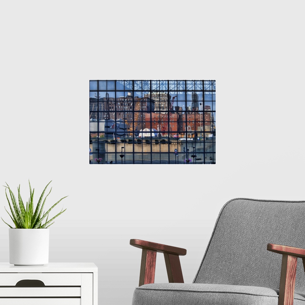 A modern room featuring Reflection of a construction site and other buildings in the windows of the Jacob K. Javits Cente...