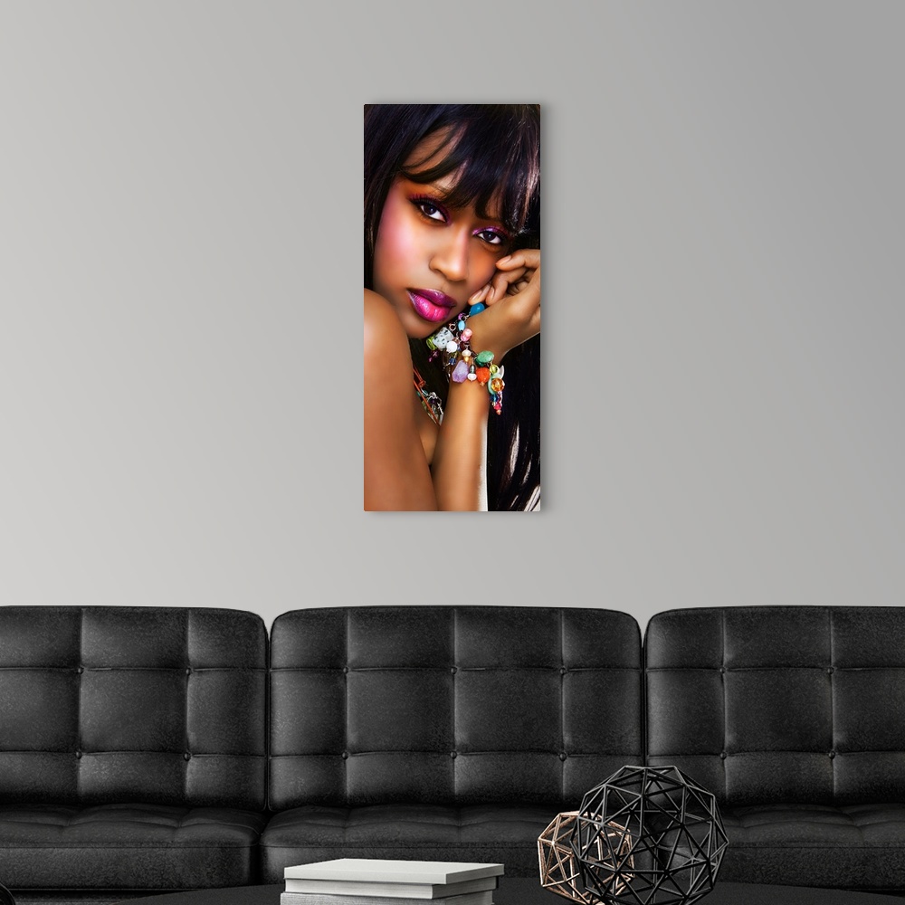 A modern room featuring portrait of ayoung black woman looking at camera