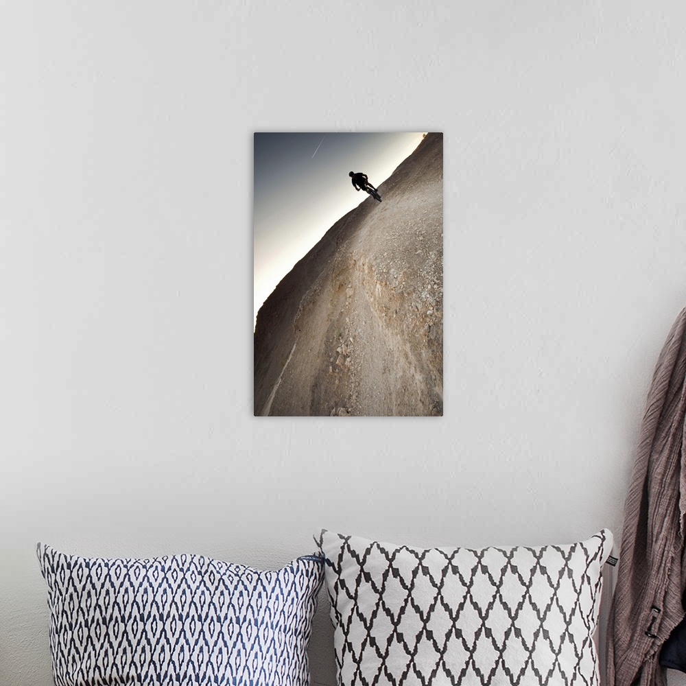 A bohemian room featuring a mountain biker makes his way across the stark desert landscape of gypsum underneath a clear sky...