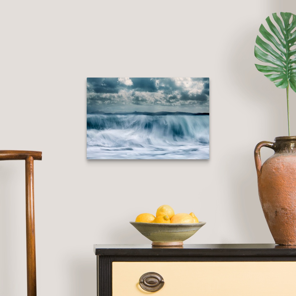 A traditional room featuring Crashing waves with a mountain background