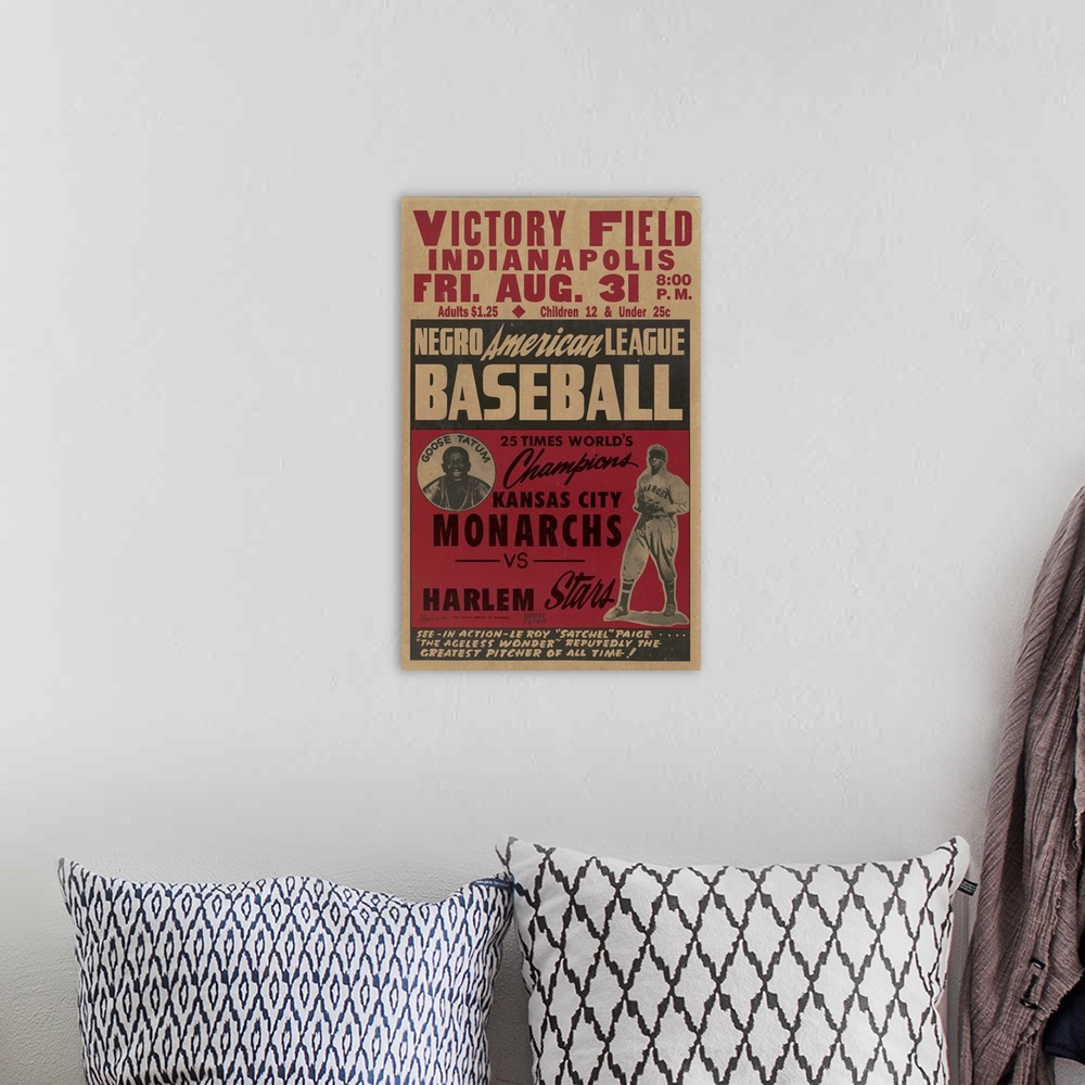 A bohemian room featuring A Negro American League baseball poster featuring Satchel Paige and Goose Tatum.