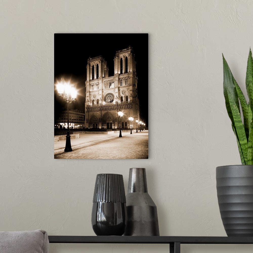 A modern room featuring Notre Dame, Paris, France at night