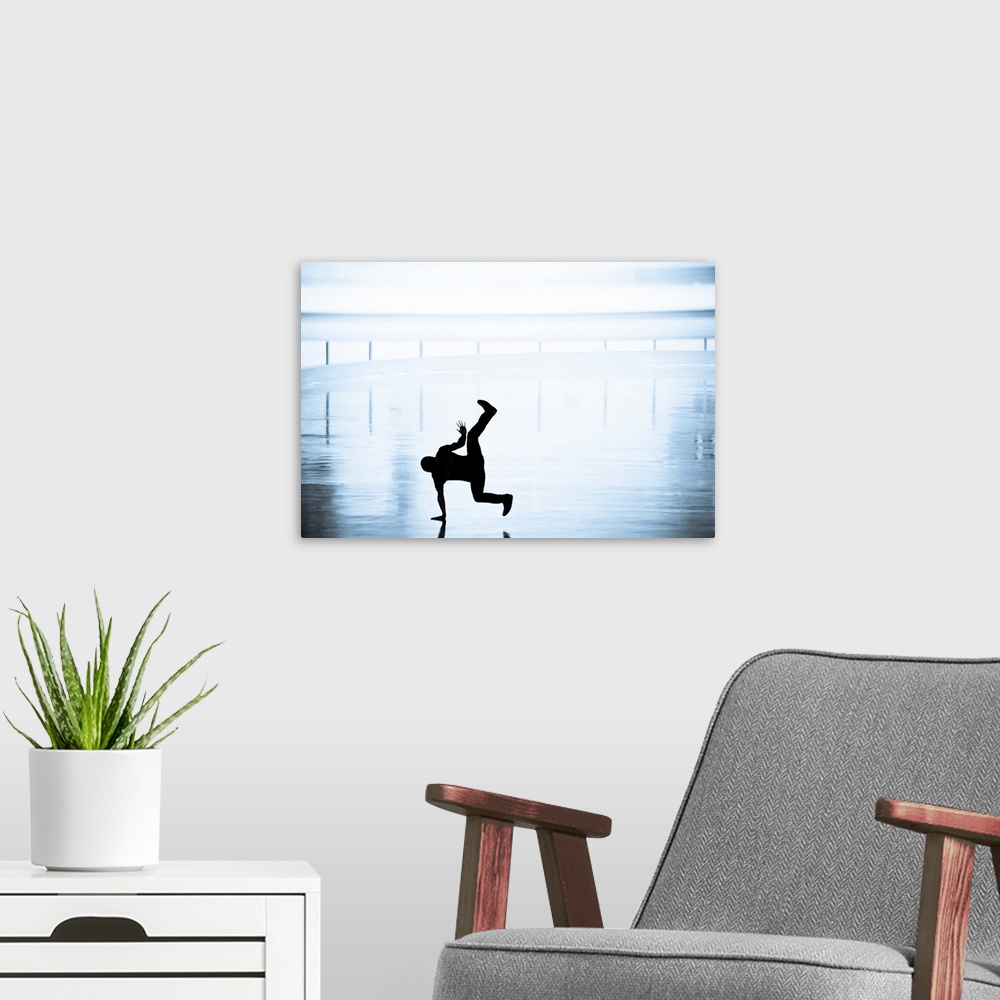A modern room featuring A silhouetted man dancing at Robson Square.