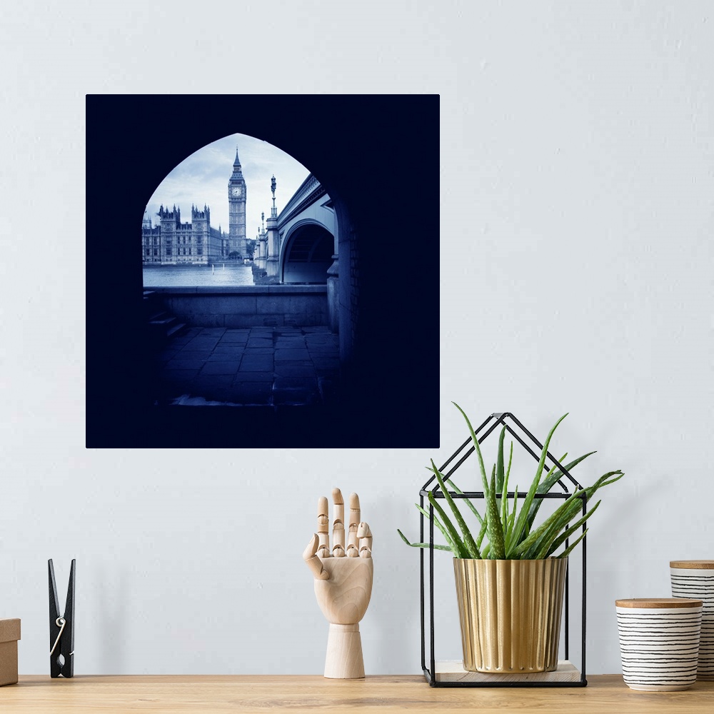 A bohemian room featuring Houses of Parliament and Big Ben seen through arch, Westminster, London, UK