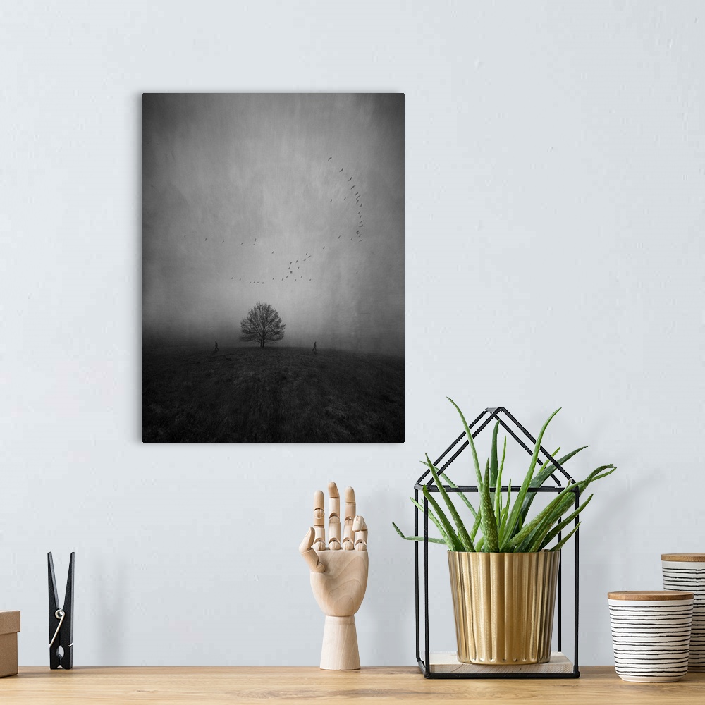 A bohemian room featuring Silhouettes of two persons walking away from each other and a lonely tree in a strange and furthe...