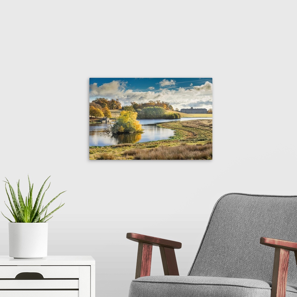 A modern room featuring Rural landscape of the West Sussex Downs from Petworth Park. Lake and trees with reflection.