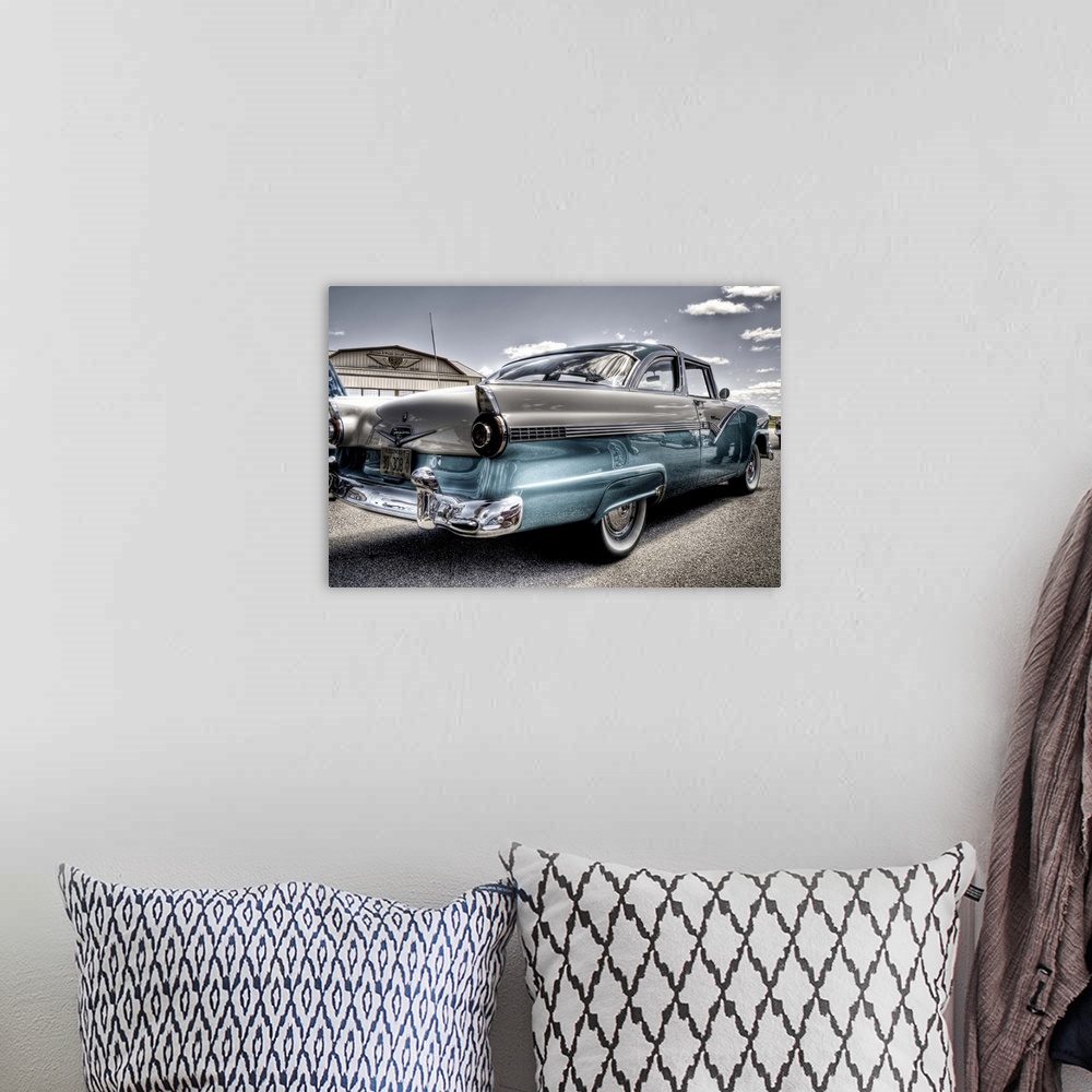 A bohemian room featuring 2 tone vintage Ford Fairlane