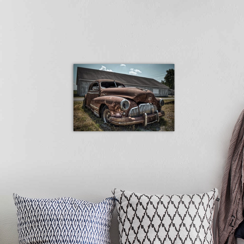 A bohemian room featuring Rusty 1942 Buick