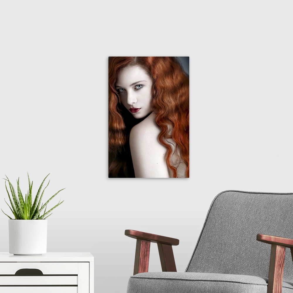 A modern room featuring A glamorous portrait of a young adult with wavy red hair looking over her shoulder