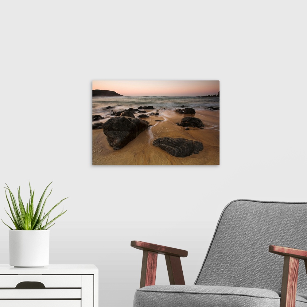 A modern room featuring Rocks and sunset at Dhail Mor beach, Lewis, Outer Hebrides