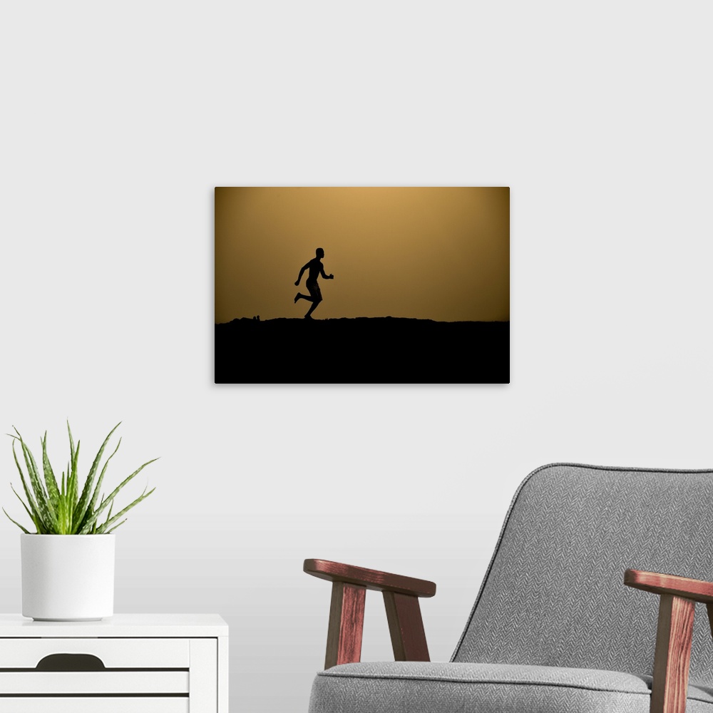A modern room featuring Barefoot man running.