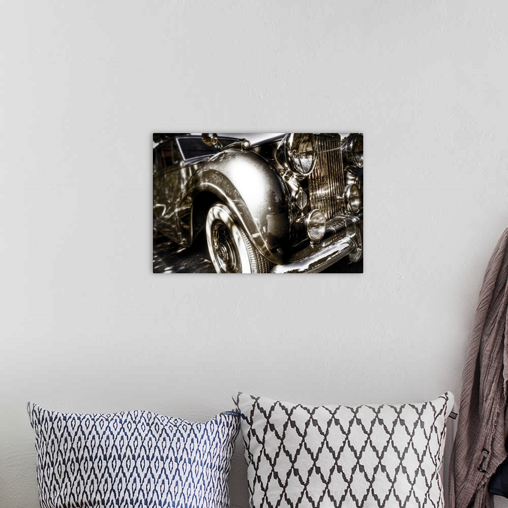 A bohemian room featuring A vintage Rolls Royce motorcar with gleaming chrome grill and bumper