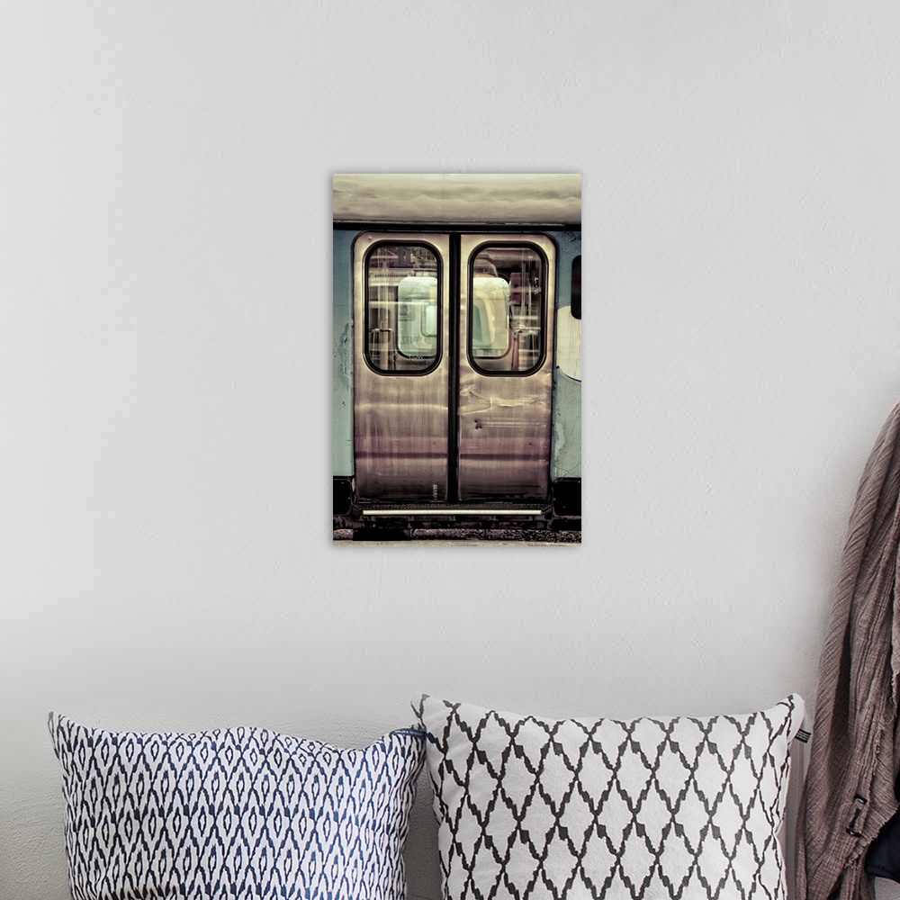 A bohemian room featuring doors to a train carraige