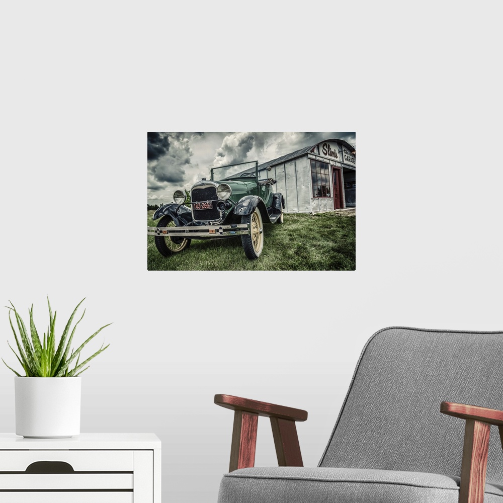A modern room featuring Vintage Model T Ford parked outside tin garage called Slim's on grass under cloudy sky