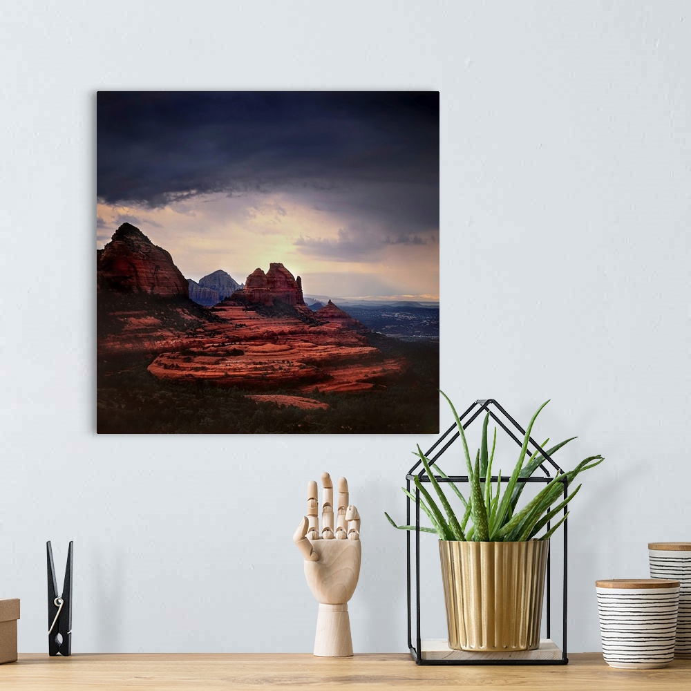 A bohemian room featuring Stormy skies ocer a mountainous landscape