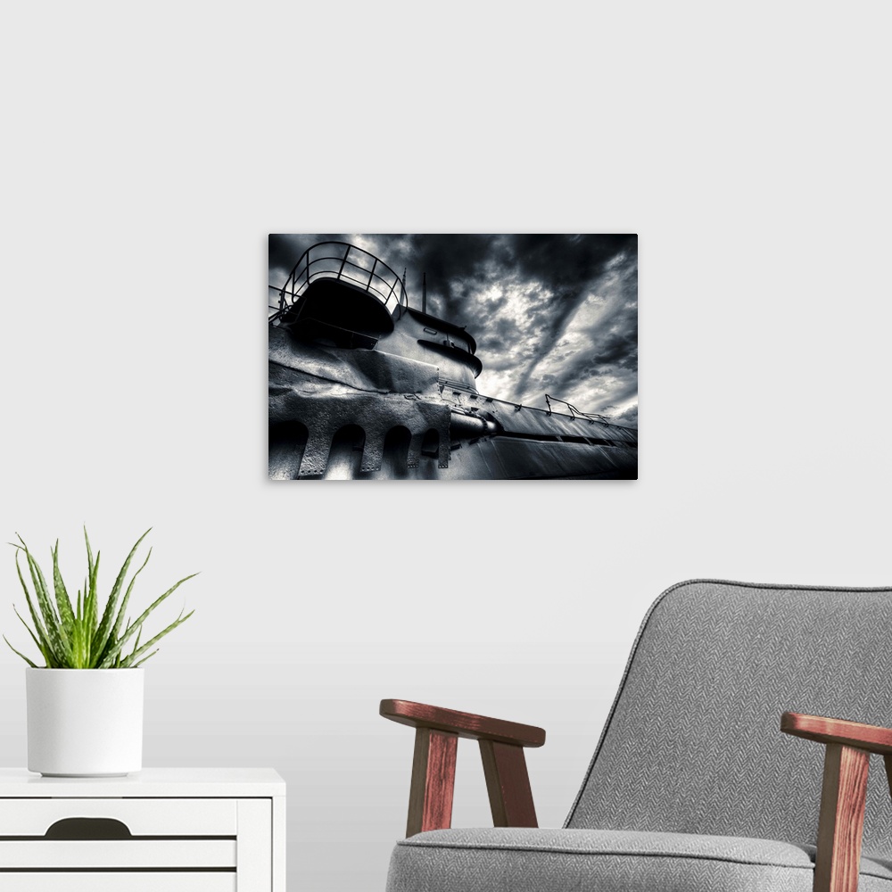 A modern room featuring German U-boat under clouds that resemble waves at sea.