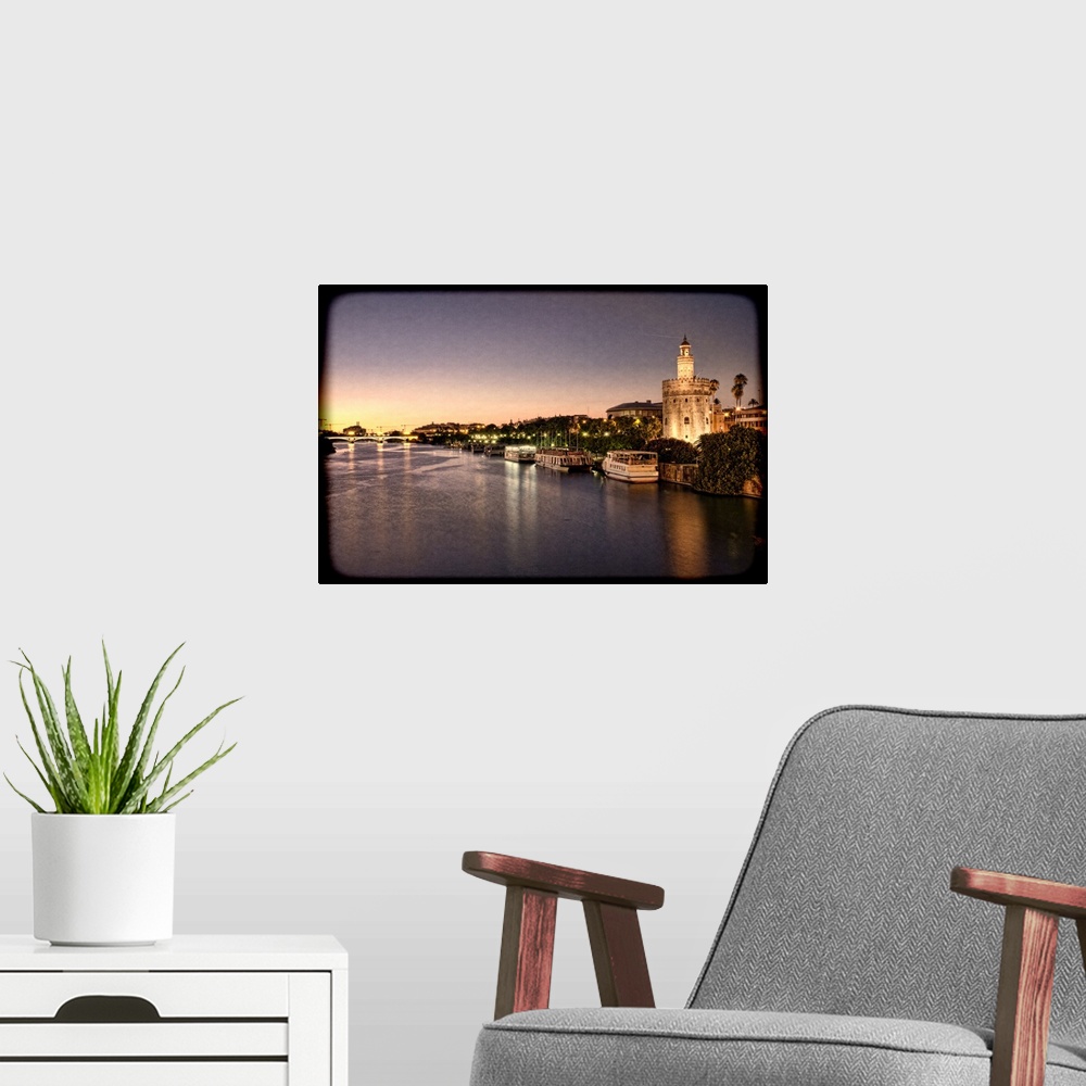 A modern room featuring Torre del Oro (Golden Tower, 12th Century Moorish building) by the Guadalquivir river, Seville, S...