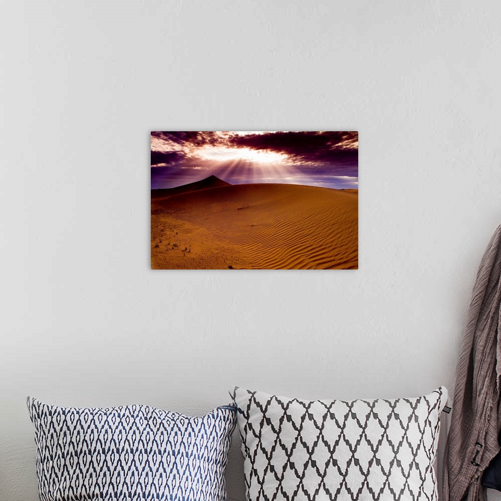 A bohemian room featuring Sunlight shining on sand dunes