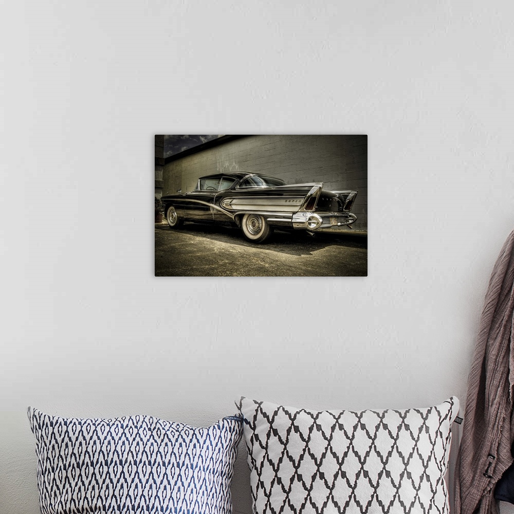 A bohemian room featuring vintage Buick Riviera