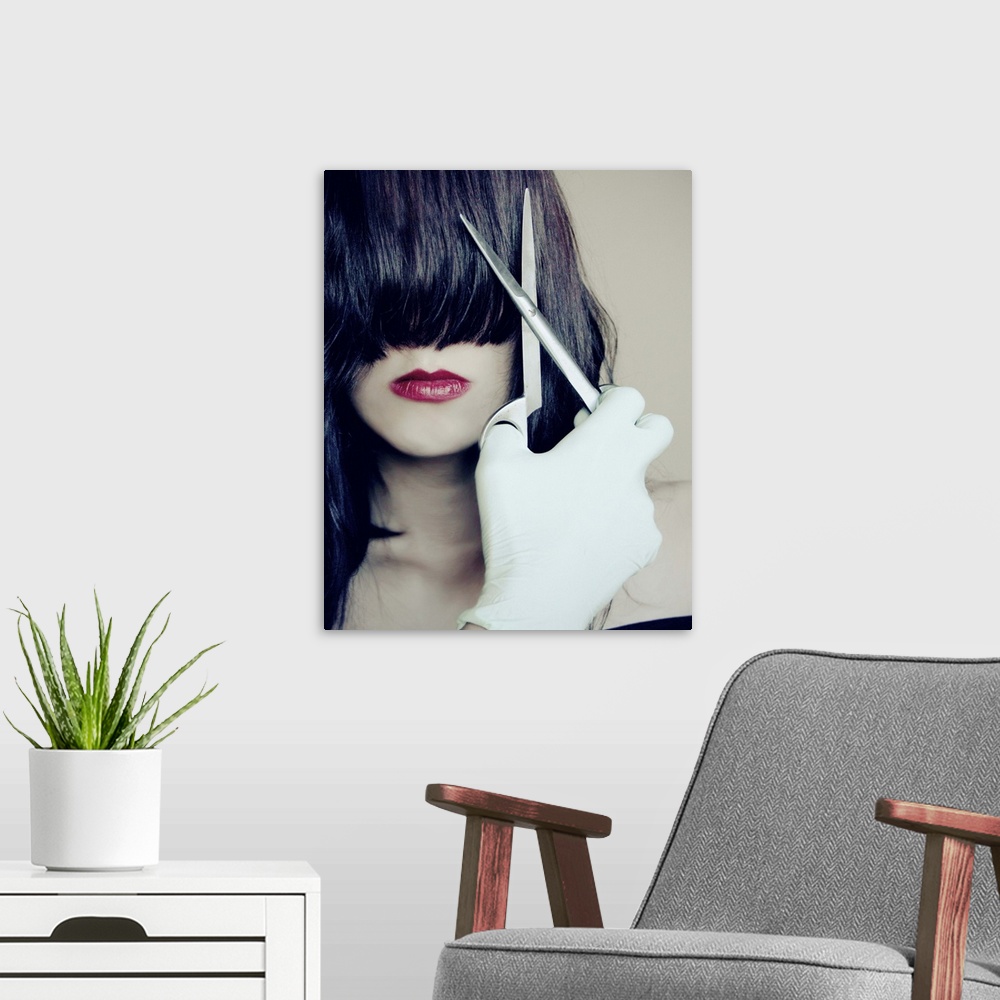 A modern room featuring Close-up portrait of a young woman with pale skin and dark hair covering her eyes, holding scisso...