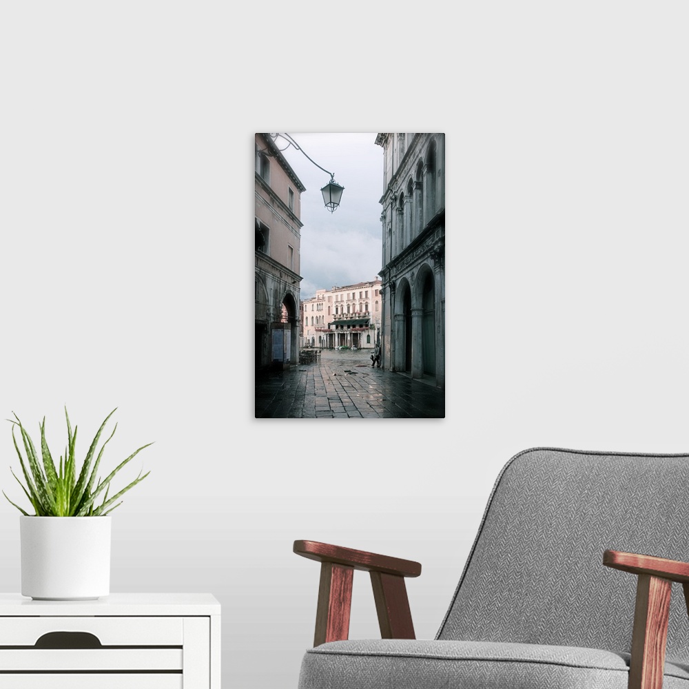 A modern room featuring Looking to a nearly deserted campo, in Venice, Italy, in the springtime.