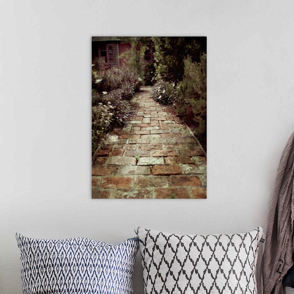 A bohemian room featuring small path made of old bricks in a cottage herb garden