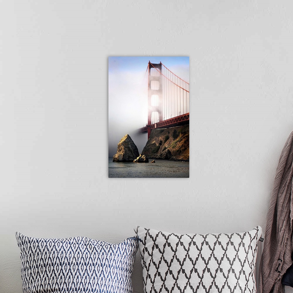 A bohemian room featuring The Golden Gate bridge shrouded in mist at sunrise