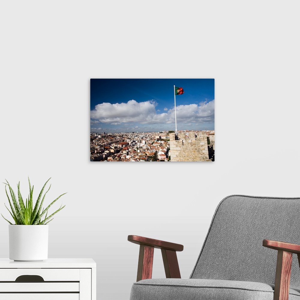 A modern room featuring The Portuguese flag fluttering over Lisbon on Saint George castle