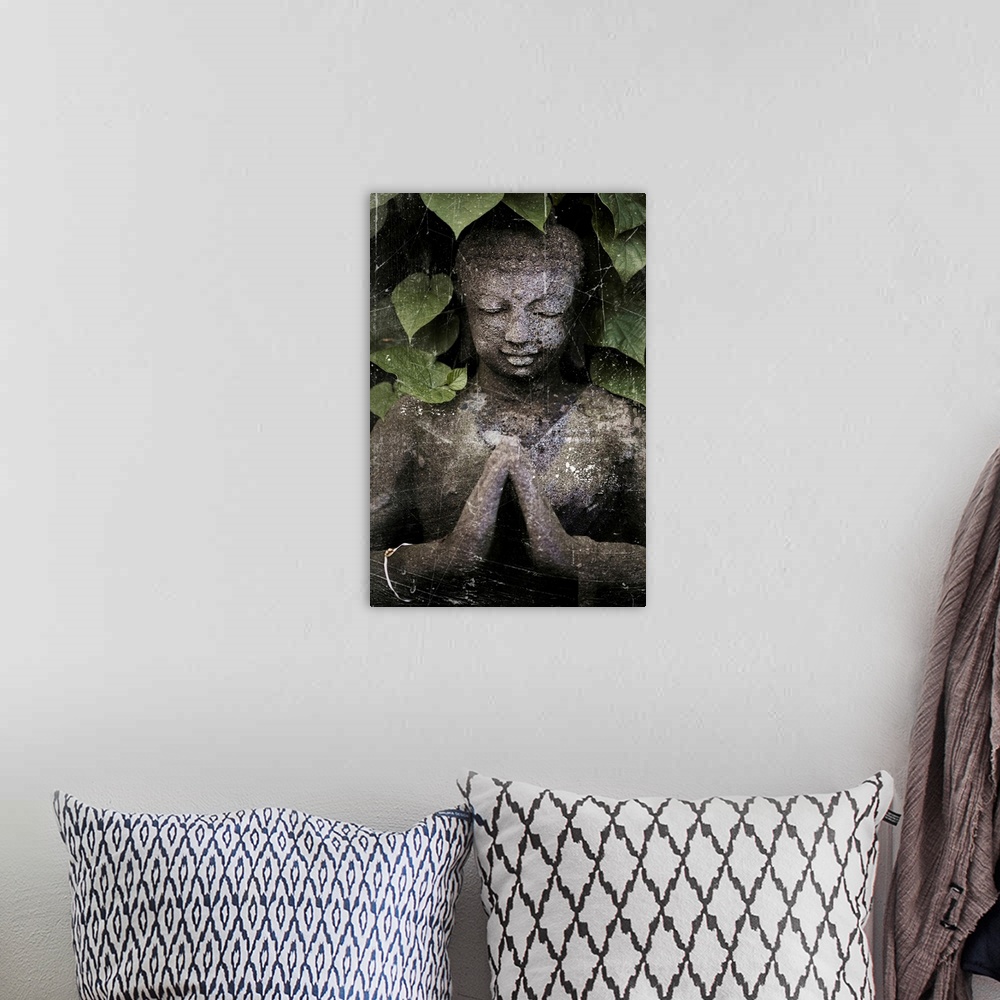 A bohemian room featuring Stone Buddha under leaves