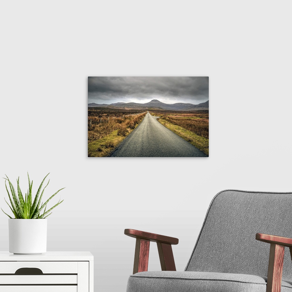 A modern room featuring Long straight road towards distant hills in Scotland, UK.