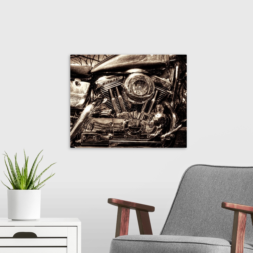 A modern room featuring Up-close photograph of engine of Harley Davidson motorcycle.