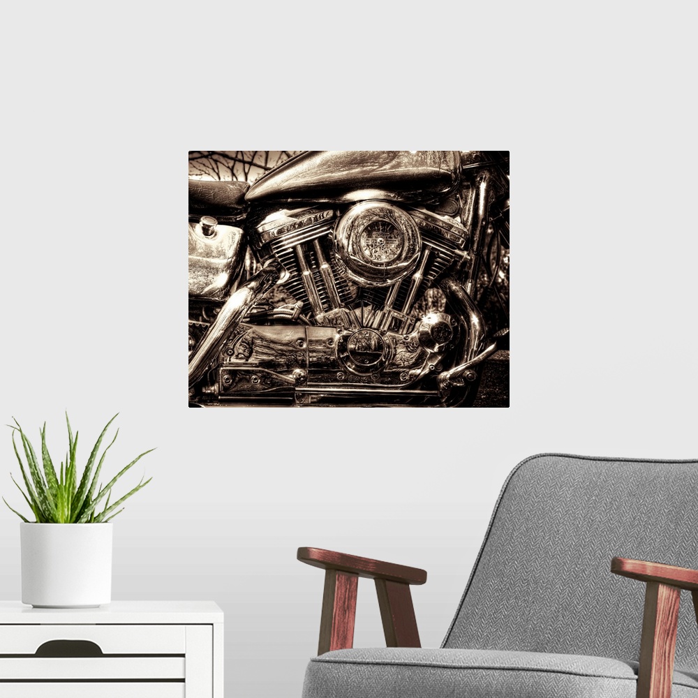 A modern room featuring Up-close photograph of engine of Harley Davidson motorcycle.
