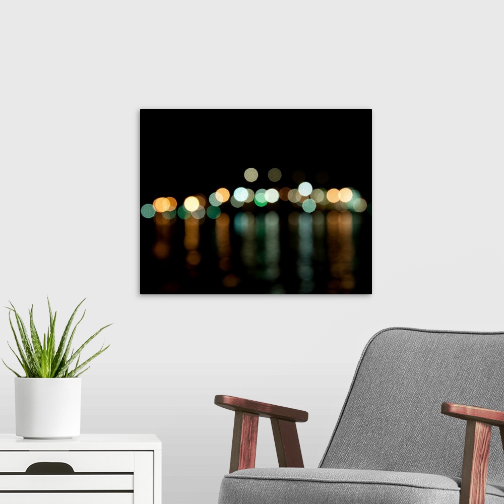 A modern room featuring Out of focus skyline of Vancouver and night