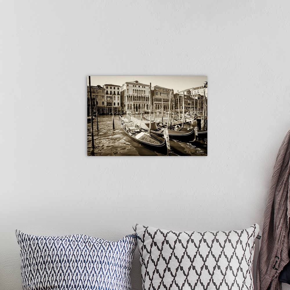 A bohemian room featuring Close up of gondolas on the grand canal in Venice, Italy in summer with buildings lining the wate...